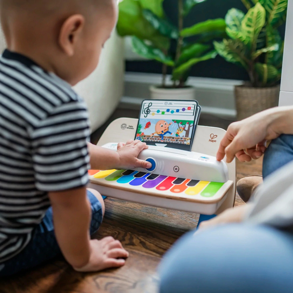 BABY EINSTEIN Hračka dřevěná hudební piano Together in Tune Piano Connected Magic Touch HAPE 12m+